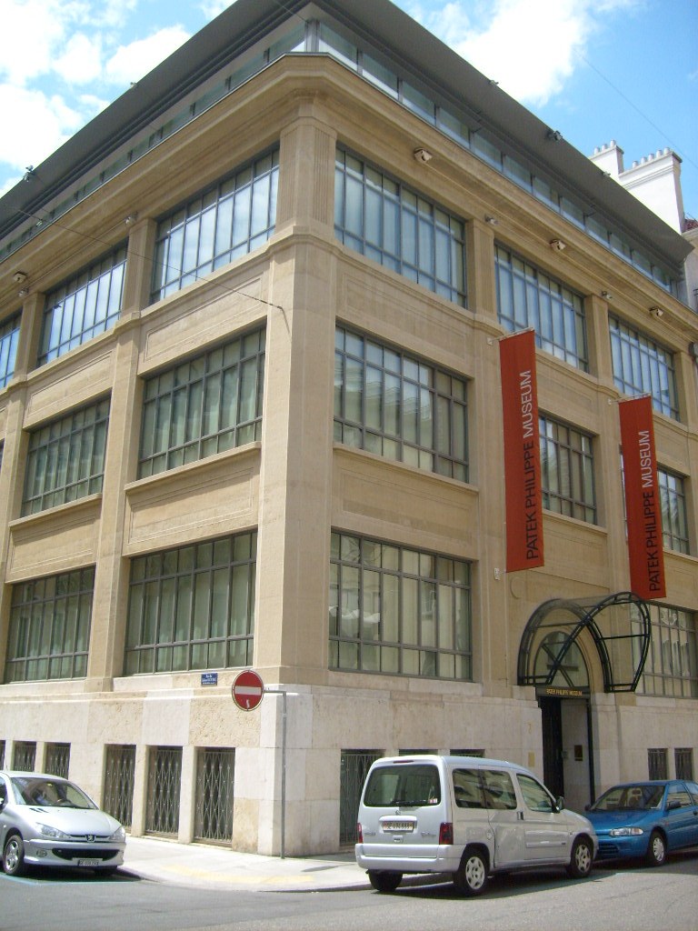 The Patek Philippe Museum building in Geneva with red banners