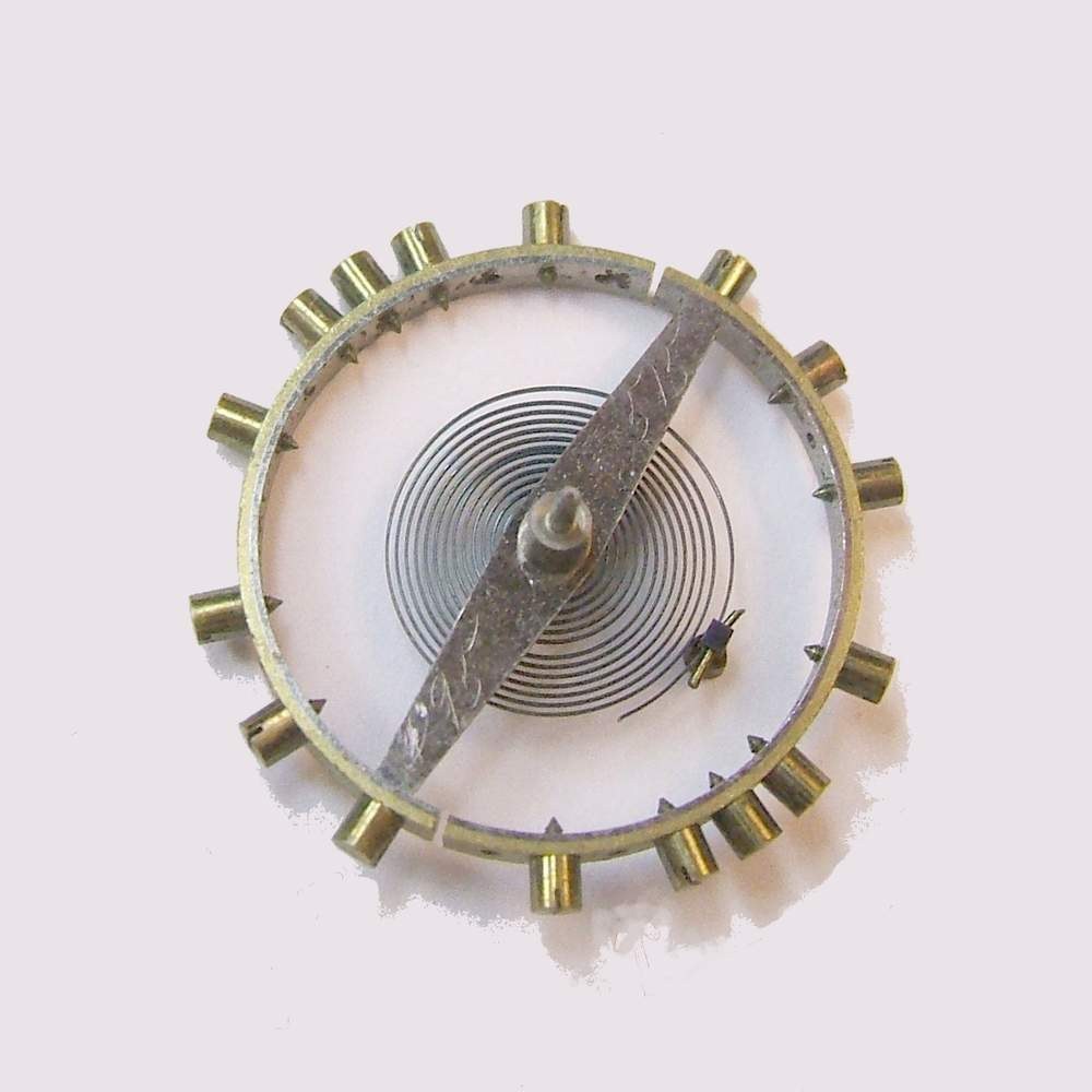 A screwed balance wheel with hairspring from an early 1900s pocket watch